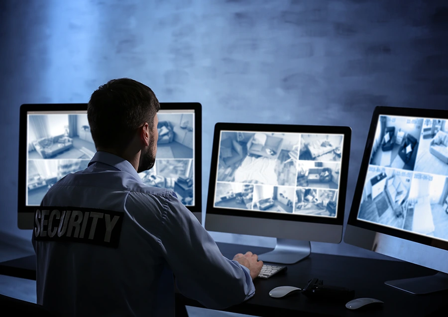 Security guard monitoring video surveillance